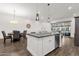 Bright, open-concept kitchen with a central island and seamless transition to the living and dining areas at 6565 E Thomas Rd # 1096, Scottsdale, AZ 85251