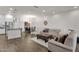 Bright, open living area featuring hardwood floors, neutral decor, and comfortable furnishings at 6565 E Thomas Rd # 1096, Scottsdale, AZ 85251