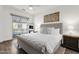 Serene main bedroom with tufted headboard, balcony access, and neutral color palette at 6565 E Thomas Rd # 1096, Scottsdale, AZ 85251