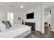 Bedroom featuring a full bed, ceiling fan, and private ensuite bathroom at 6565 E Thomas Rd # 1096, Scottsdale, AZ 85251