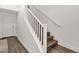 Elegant staircase with white railings and wood-look steps offers a seamless transition at 6565 E Thomas Rd # 1096, Scottsdale, AZ 85251