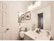 Bright bathroom with a grey vanity, updated fixtures, and clean white walls at 7222 W Maryland Ave, Glendale, AZ 85303