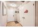 Inviting entryway featuring neutral paint, tile flooring, a coat closet, and white doors at 7222 W Maryland Ave, Glendale, AZ 85303
