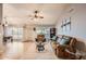 Bright living room featuring tile flooring, comfortable seating, and an open layout with backyard views at 7222 W Maryland Ave, Glendale, AZ 85303