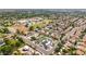 Expansive aerial view of a neighborhood featuring mature trees, lush landscaping, and various home styles in a desirable location at 7833 S Kenneth Pl, Tempe, AZ 85284
