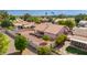 Aerial view showcasing the large backyard, offering a block wall, desert landscaping and covered patio at 7833 S Kenneth Pl, Tempe, AZ 85284