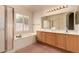 Bathroom with double sinks, bathtub and a separate glass shower at 7833 S Kenneth Pl, Tempe, AZ 85284