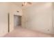 Neutral carpeted bedroom with doors to bathroom and closet at 7833 S Kenneth Pl, Tempe, AZ 85284