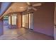 Relaxing covered patio with ceiling fans and access to the home's interior at 7833 S Kenneth Pl, Tempe, AZ 85284