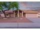 Charming single-story home featuring a well-maintained front yard and two-car garage at 7833 S Kenneth Pl, Tempe, AZ 85284