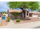 Well-maintained single-story home with mature landscaping, desert yard and inviting entrance at 7833 S Kenneth Pl, Tempe, AZ 85284