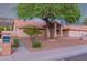 Well-maintained single-story home with mature landscaping, desert yard and inviting entrance at 7833 S Kenneth Pl, Tempe, AZ 85284