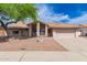 Charming single-story home featuring a well-maintained front yard and two-car garage at 7833 S Kenneth Pl, Tempe, AZ 85284