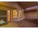 Inviting front porch with brick flooring and stylish accents and protective security screen at 7833 S Kenneth Pl, Tempe, AZ 85284