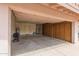 Spacious garage featuring built in storage cabinets at 7833 S Kenneth Pl, Tempe, AZ 85284