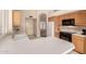Bright kitchen featuring white countertops and tile backsplash at 7833 S Kenneth Pl, Tempe, AZ 85284