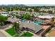 Expansive aerial view of property with mature trees, lush lawns, and sparkling pool at 8214 E Northland Dr, Scottsdale, AZ 85251