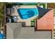 Aerial view showcasing a private backyard oasis with a sparkling pool, lounge area, lush greenery, and mature landscaping at 8214 E Northland Dr, Scottsdale, AZ 85251