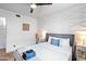 Inviting bedroom with a plush bed, modern nightstands, and decorative wall paneling at 8214 E Northland Dr, Scottsdale, AZ 85251