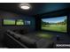 Deluxe entertainment room featuring golf simulator and multiple screens, perfect for leisure and sports enthusiasts at 8214 E Northland Dr, Scottsdale, AZ 85251