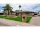 Inviting single story home with lush lawn, mature trees, and neutral tones with excellent curb appeal at 8214 E Northland Dr, Scottsdale, AZ 85251