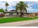 Charming single-story home with lush green lawn and mature trees, with great curb appeal at 8214 E Northland Dr, Scottsdale, AZ 85251