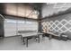 Finished garage featuring a ping pong table, seating area, and stylish LED lighting at 8214 E Northland Dr, Scottsdale, AZ 85251