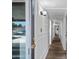Hallway with white molding leading to the backyard and pool at 8214 E Northland Dr, Scottsdale, AZ 85251