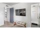 Hallway with a bench, tv, and access to a walk-in shower at 8214 E Northland Dr, Scottsdale, AZ 85251