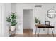 Bright hallway featuring stylish table, decor, and white wainscoting at 8214 E Northland Dr, Scottsdale, AZ 85251