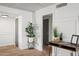 Light and airy hallway with decorative plants and neutral color scheme at 8214 E Northland Dr, Scottsdale, AZ 85251