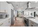 View of the kitchen and living room in a modern open floor plan at 8214 E Northland Dr, Scottsdale, AZ 85251