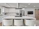 Bright, modern kitchen featuring quartz island and stainless steel appliances at 8214 E Northland Dr, Scottsdale, AZ 85251