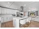 Open-concept kitchen with a center island, stainless steel appliances, and bar seating at 8214 E Northland Dr, Scottsdale, AZ 85251