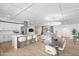 Bright open-concept living space with hardwood floors, modern lighting, dining area, and seamless flow at 8214 E Northland Dr, Scottsdale, AZ 85251