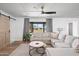 Cozy living room with neutral color palette, plush sectional sofa, and hardwood floors at 8214 E Northland Dr, Scottsdale, AZ 85251