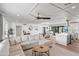 Bright open-concept living space with hardwood floors, modern lighting, and seamless flow to kitchen at 8214 E Northland Dr, Scottsdale, AZ 85251