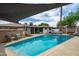 Refreshing pool surrounded by ample lounge space and outdoor amenities perfect for sunny days and entertaining at 8214 E Northland Dr, Scottsdale, AZ 85251