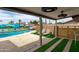 Stunning backyard pool featuring lounge areas, a grill, and a playful mural, creating an ideal outdoor living space at 8214 E Northland Dr, Scottsdale, AZ 85251