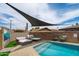 Private pool featuring relaxing lounge areas and colorful floral accents creating a tranquil backyard oasis at 8214 E Northland Dr, Scottsdale, AZ 85251