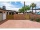View of the house with brick accent walls and lush greenery offering a secluded and inviting outdoor space at 8214 E Northland Dr, Scottsdale, AZ 85251