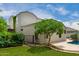 Backyard view featuring well-maintained greenery, an exterior with access to the pool at 887 W Santa Gertrudis Trl, San Tan Valley, AZ 85143