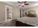Bedroom with carpet flooring and neutral tones with ensuite bathroom and walk in closet at 887 W Santa Gertrudis Trl, San Tan Valley, AZ 85143