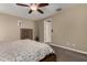 Bedroom with neutral tones, wooden bed frame, and carpet flooring at 887 W Santa Gertrudis Trl, San Tan Valley, AZ 85143