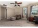 Bonus room with neutral tones, features a ceiling fan, and a cozy seating area at 887 W Santa Gertrudis Trl, San Tan Valley, AZ 85143