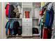 Well-organized walk-in closet with clothing racks, shelves, and ample storage space at 887 W Santa Gertrudis Trl, San Tan Valley, AZ 85143