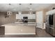 Beautiful kitchen featuring a large island, granite countertops, and stainless steel appliances at 887 W Santa Gertrudis Trl, San Tan Valley, AZ 85143