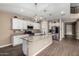 Modern kitchen with granite countertops, stainless steel appliances, and stylish pendant lighting at 887 W Santa Gertrudis Trl, San Tan Valley, AZ 85143