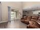 Bright living room with access to backyard pool through sliding glass doors at 887 W Santa Gertrudis Trl, San Tan Valley, AZ 85143