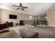 Open loft area with desk, tv, and sitting area at 887 W Santa Gertrudis Trl, San Tan Valley, AZ 85143